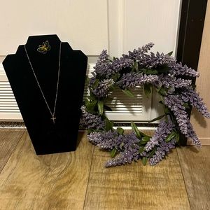 Cross with intertwined circles in center, 14k G.F., with butterfly pin.